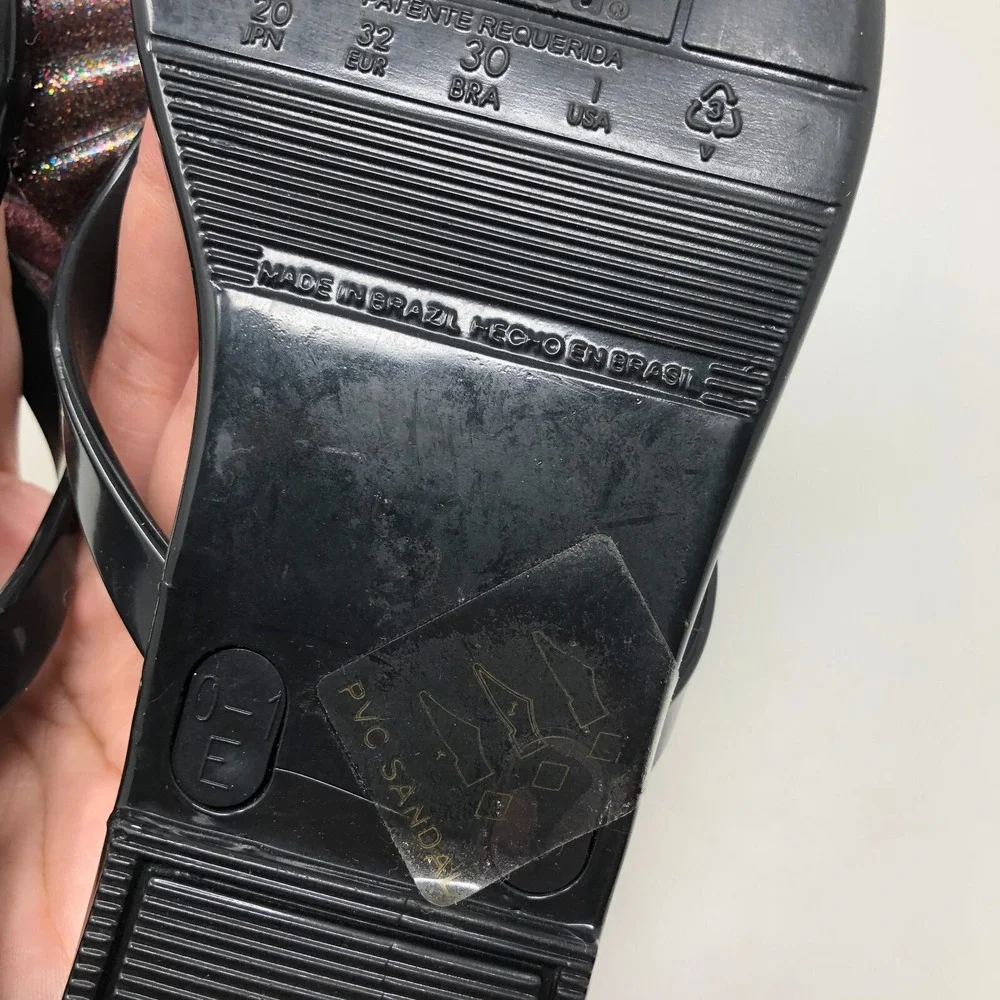 Melissa Mel Harmonic Bow Vi INF Flip Flops Girls 1 Black Glitter Scented